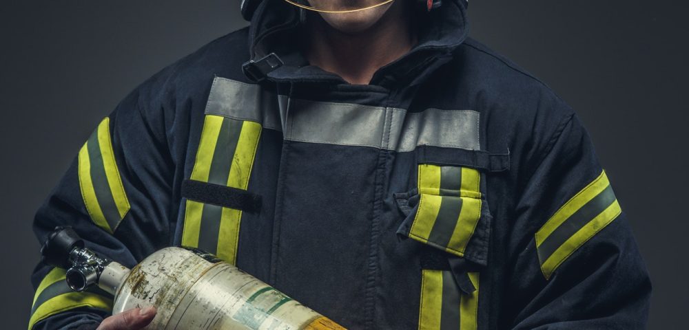 firefighter-rescue-holds-yellow-oxygen-tank-.jpg